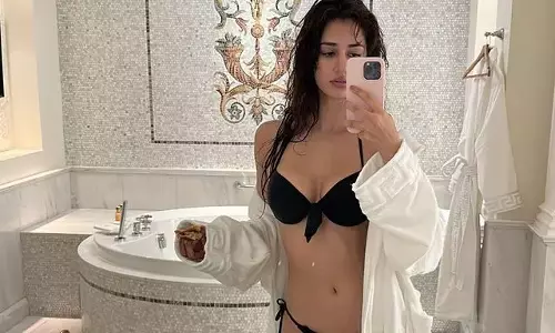 Disha Patani Stuns In Chic Beachwear For Latest Photoshoot