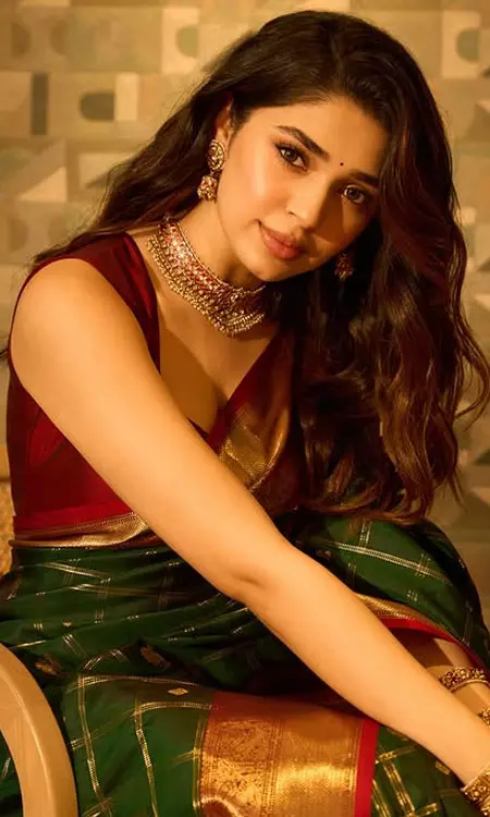 Krithi Shetty Stuns in Deep Green Pattu Saree with Gold Jewelry