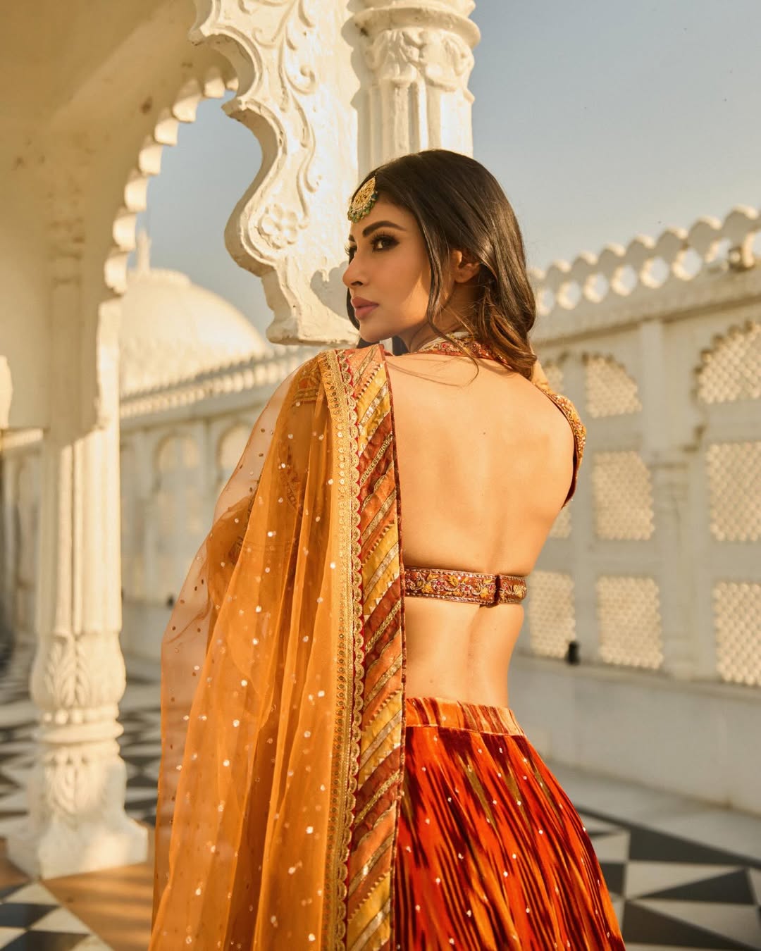 mouni roy orange dress The Weekend Forecast Looks Bright With Mouni Roy In A Fiery Orange Backless Draped Dress And Gold Gladiators