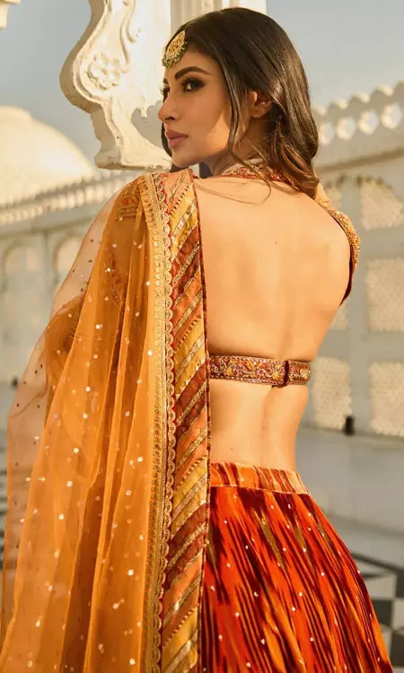 Mouni Roy Radiates Festive Charm in Vibrant Orange Lehenga