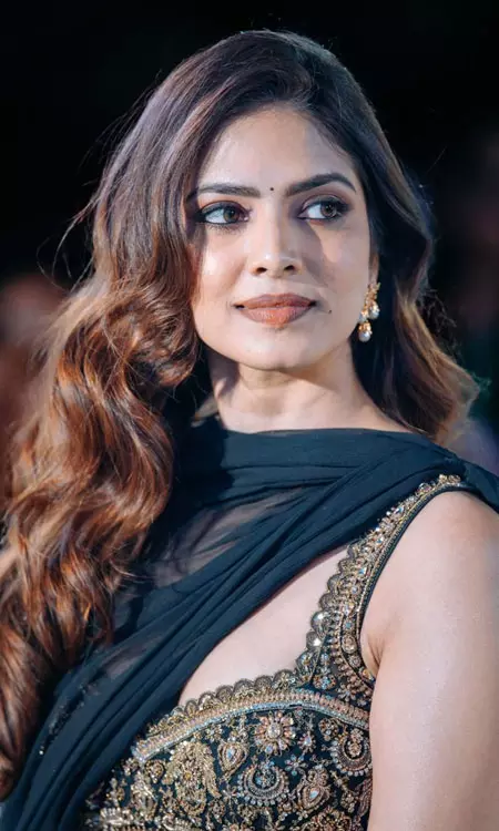 Malavika Mohanan Dazzles with Regal Elegance at Raja Saab Event