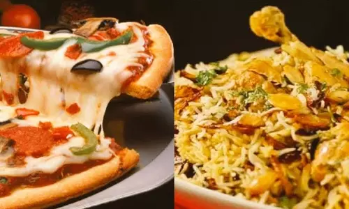 నిమిషానికి 2లక్షల పిజ్జాలు, 1,336 బిర్యానీల ఆర్డర్...న్యూఇయర్ రికార్డ్