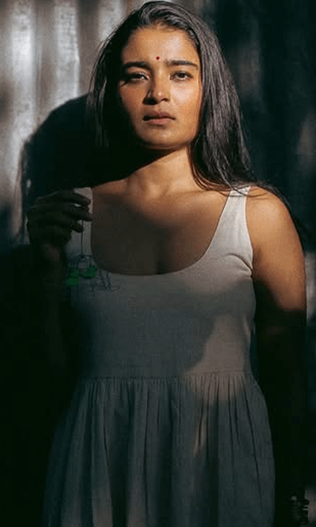 Shadow Game: Chaithra J Achars Enigmatic Glow in Dramatic Light