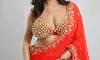 Simran Kaur Ignites in Custom Crimson Saree by Sherina Kapany