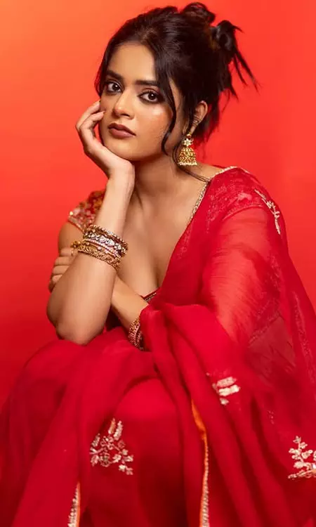Riddhi Kumar Shines in Red at The Raja Saab Press Conference