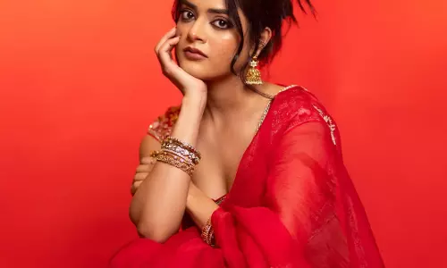 Riddhi Kumar Shines in Red at The Raja Saab Press Conference