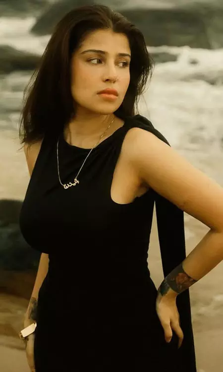 Edin Rose Radiates Effortless Elegance in Black Dress on the Beach