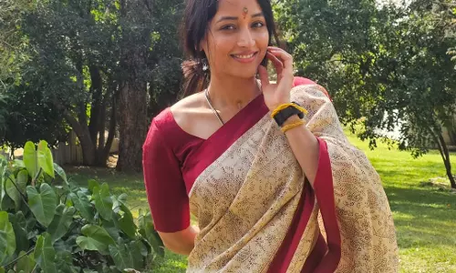 Srinidhi Shetty Enjoys a Peaceful Sunlit Moment in a Saree