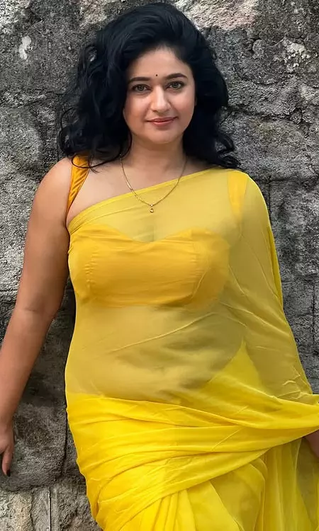 South Actress Poonam Bajwa Wows Fans in Sheer Yellow Saree