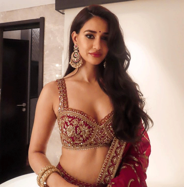 Disha Patani Stuns in Orange Lehenga: Regal & Glamorous Photoshoot