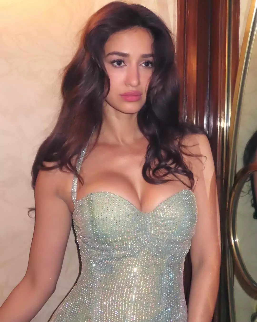 Disha Patani Stuns in Orange Lehenga: Regal & Glamorous Photoshoot Disha Patani Stuns in Orange Lehenga: Regal & Glamorous Photoshoot