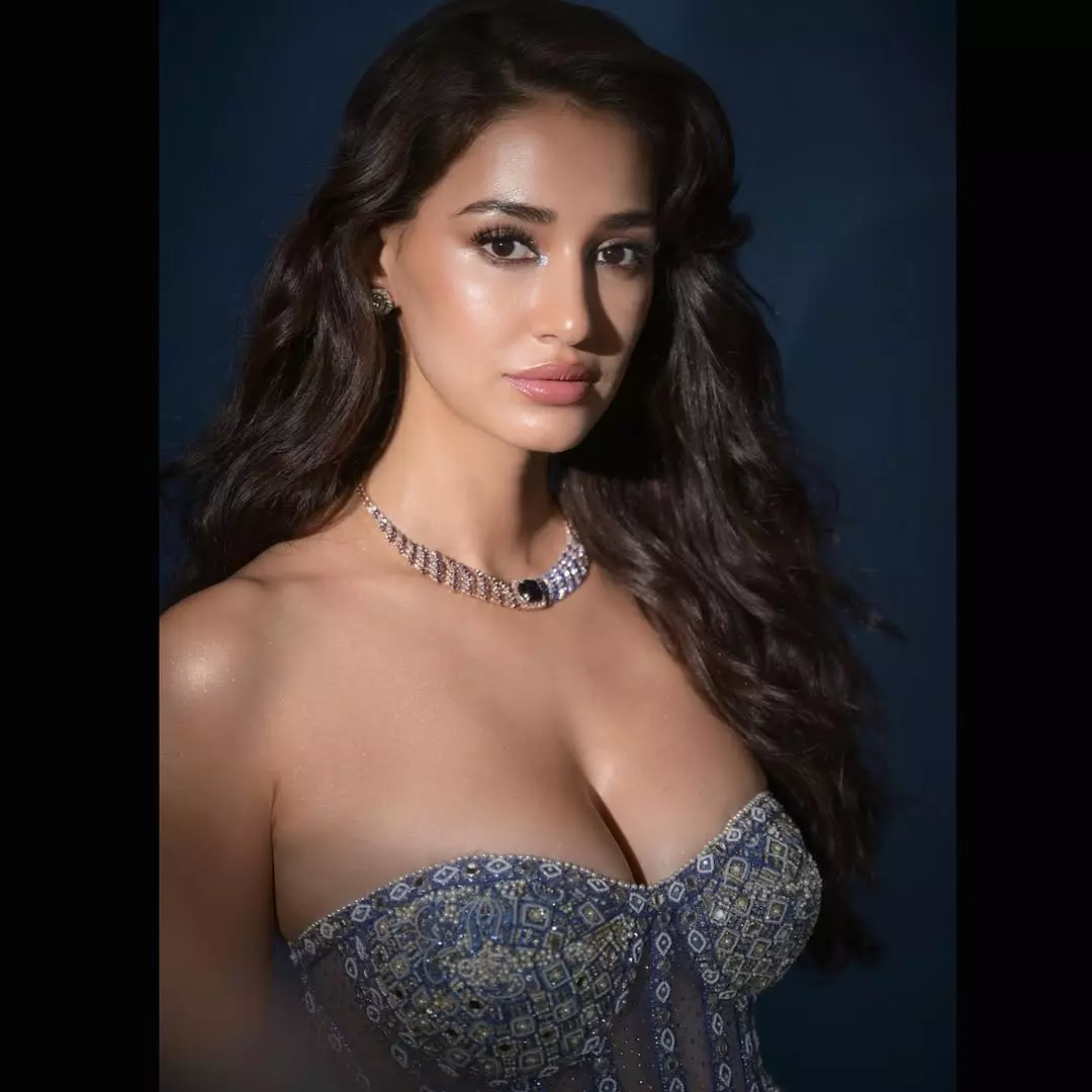 Disha Patani Stuns in Orange Lehenga: Regal & Glamorous Photoshoot