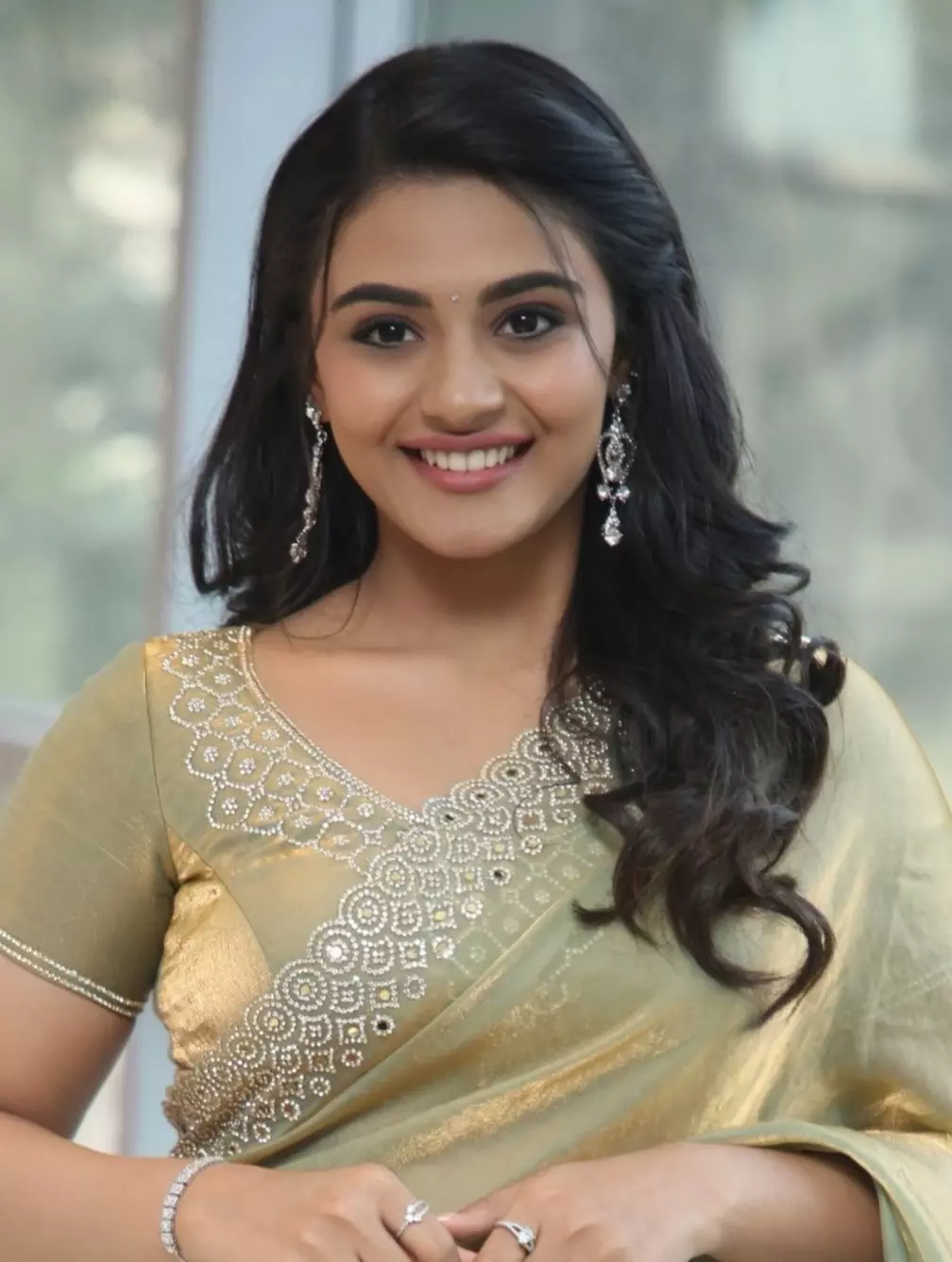 Nayan Sarika Radiates Elegance In Golden-Green Saree