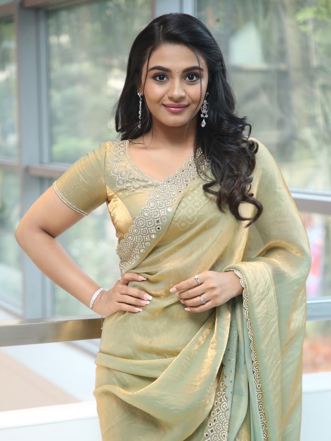 Nayan Sarika Radiates Elegance In Golden-Green Saree