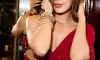 Rhea Chakraborty Stuns in Elegant Red Saree Look