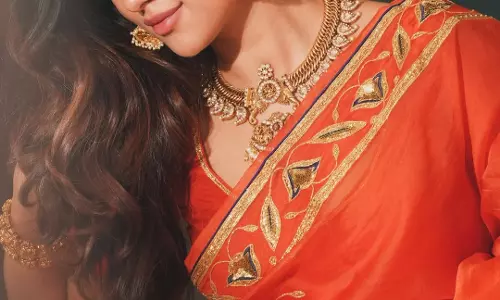 Anu Emmanuel Stuns in Orange Raw Mango Saree with Timeless Elegance
