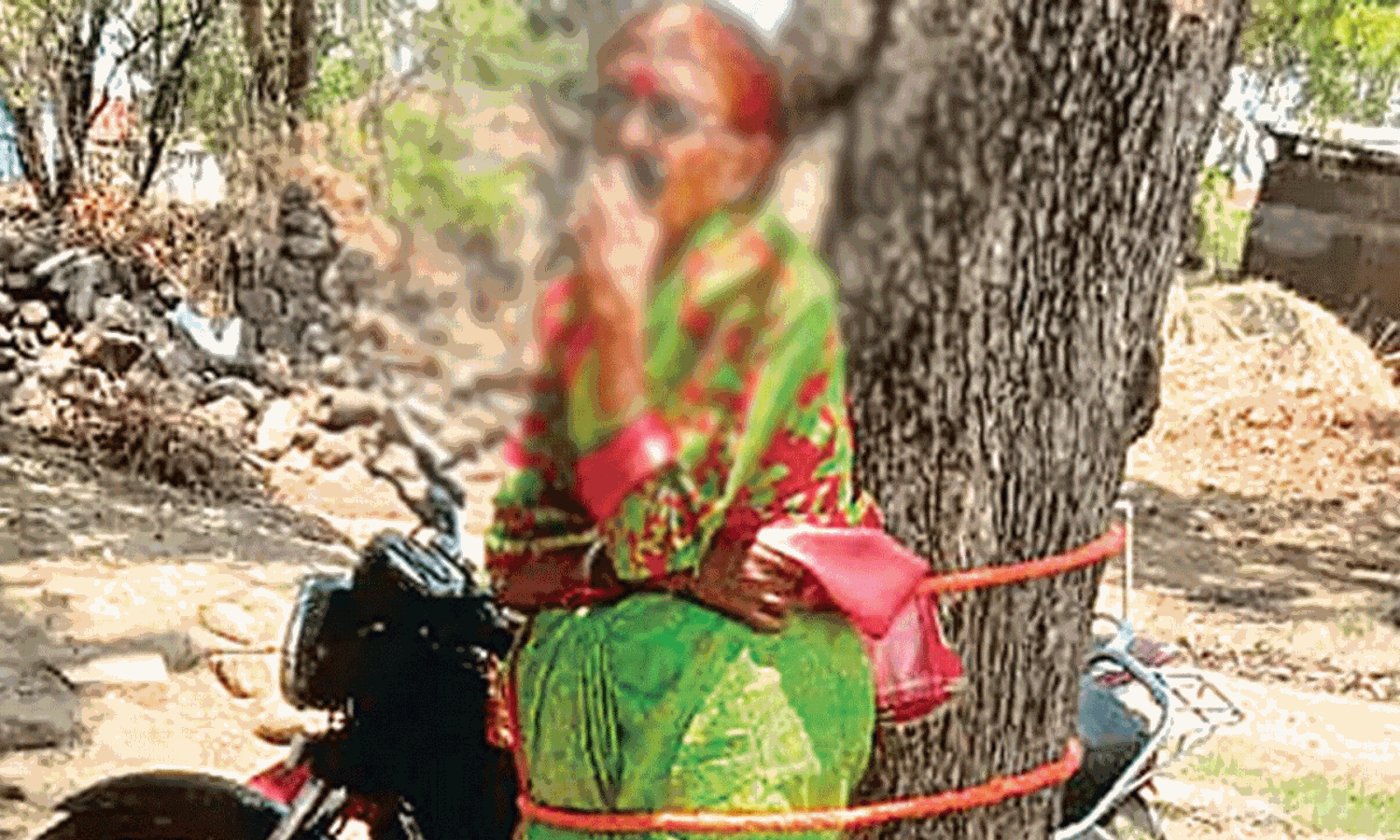 భర్త మోసం చేస్తే.. భార్యను చెట్టుకు కట్టేసి హింసించటమా?