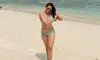 Pragya Jaiswal Stuns in Turquoise Bikini with a Radiant Beach Look