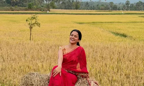 Vaishnavi Chaitanya Stuns in Red Saree Amid Scenic Paddy Fields