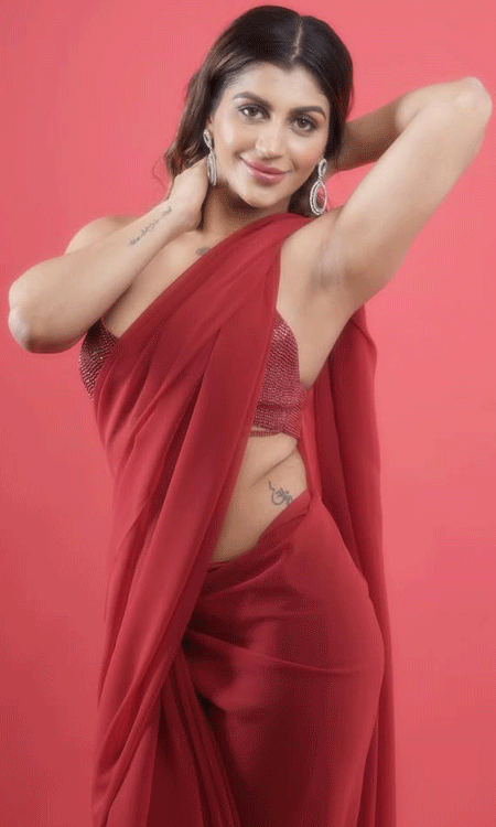 yashika aanand stuns in bold red saree look with glamorous style