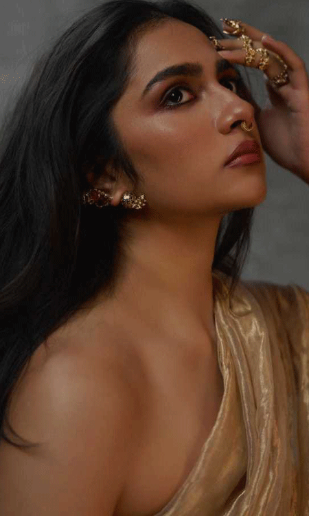 Rukmini Vasanth Stuns in Gold Off Shoulder Outfit with Ethereal Charm