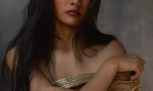 Rukmini Vasanth Stuns in Gold Off Shoulder Outfit with Ethereal Charm