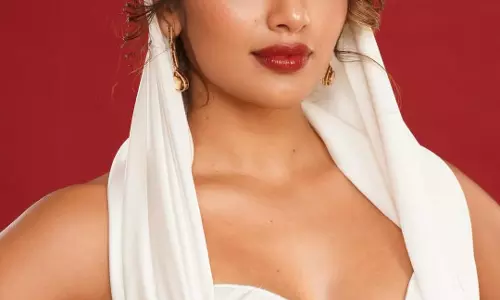 White Magic on Crimson: Tejaswi Madivadas Portrait