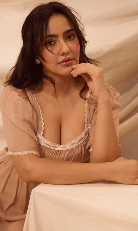 Neha Sharma Stuns in Elegant Beige Dress, Radiates Sensual Charm