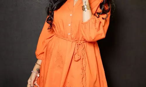 Telugu Star Sreemukhi Turns Heads with Glamorous Orange Outfit Photos