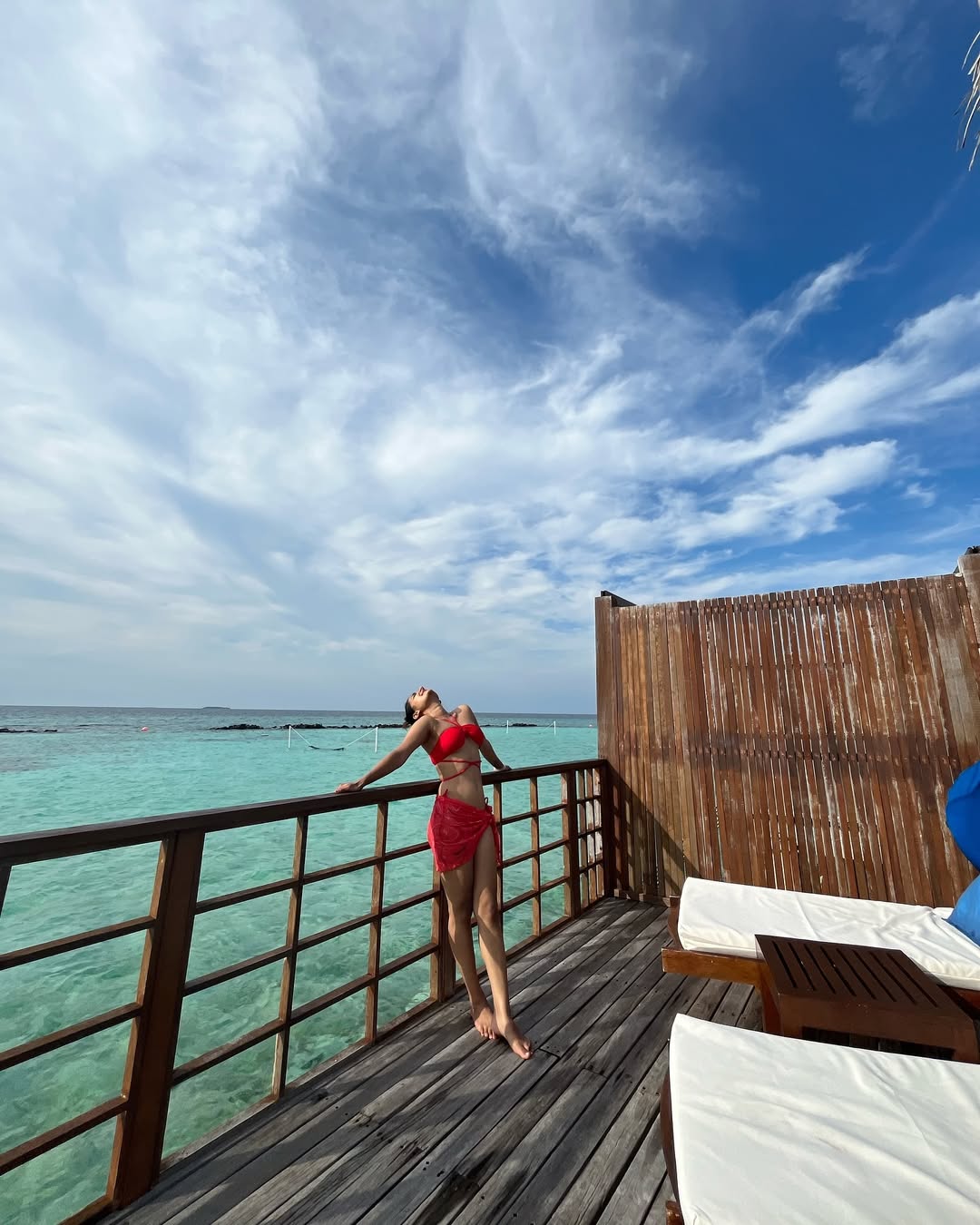 Esther Anil Stuns In Vibrant Red Beachwear During Tropical Vacation