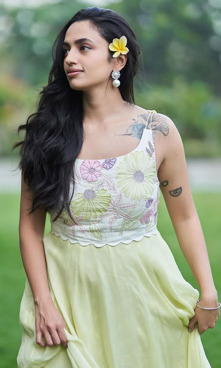 Malavika Nair Glows in Yellow Floral Outfit with Natural Grace