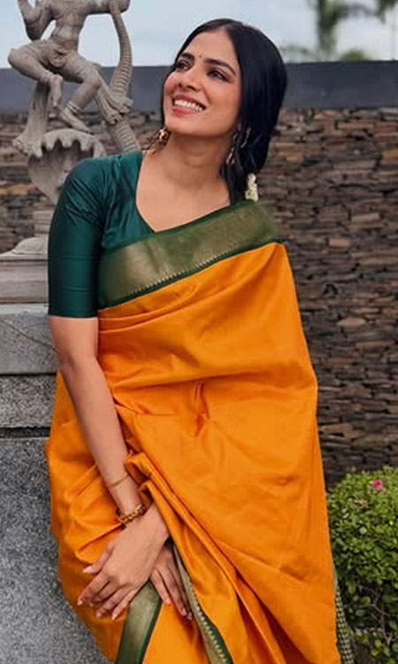 Malavika Mohanan Lights Up Chennai in Vibrant Orange Saree