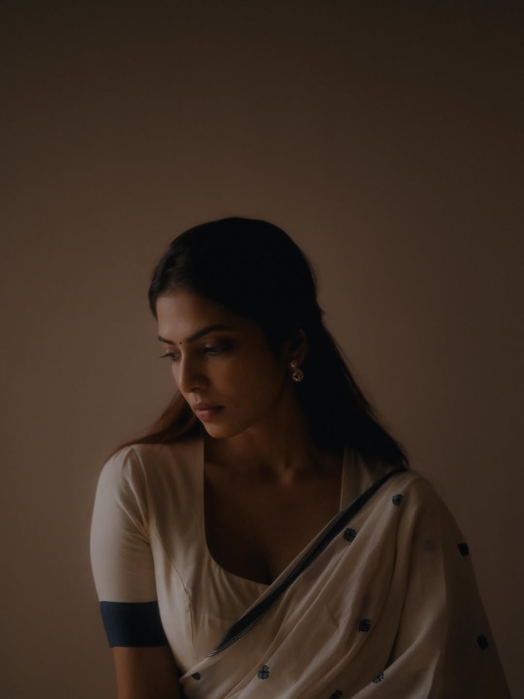 Malavika Mohanan Radiates Grace in Elegant Off-White Saree Look