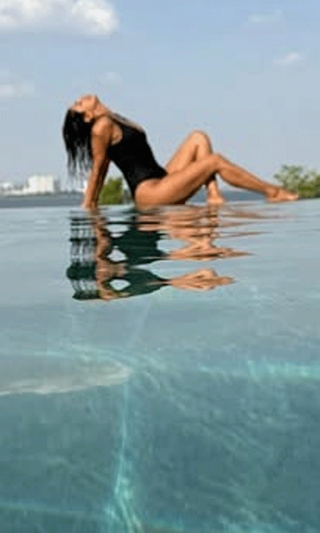 Priyanka Chopra’s Mesmerizing Infinity Pool Glow in Black Swimsuit