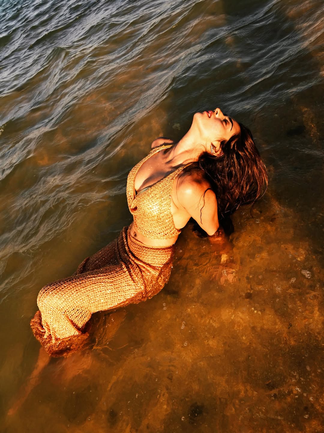 Roshni Walia Stuns In Golden Beach Shoot With Powerful “Reborn” Caption