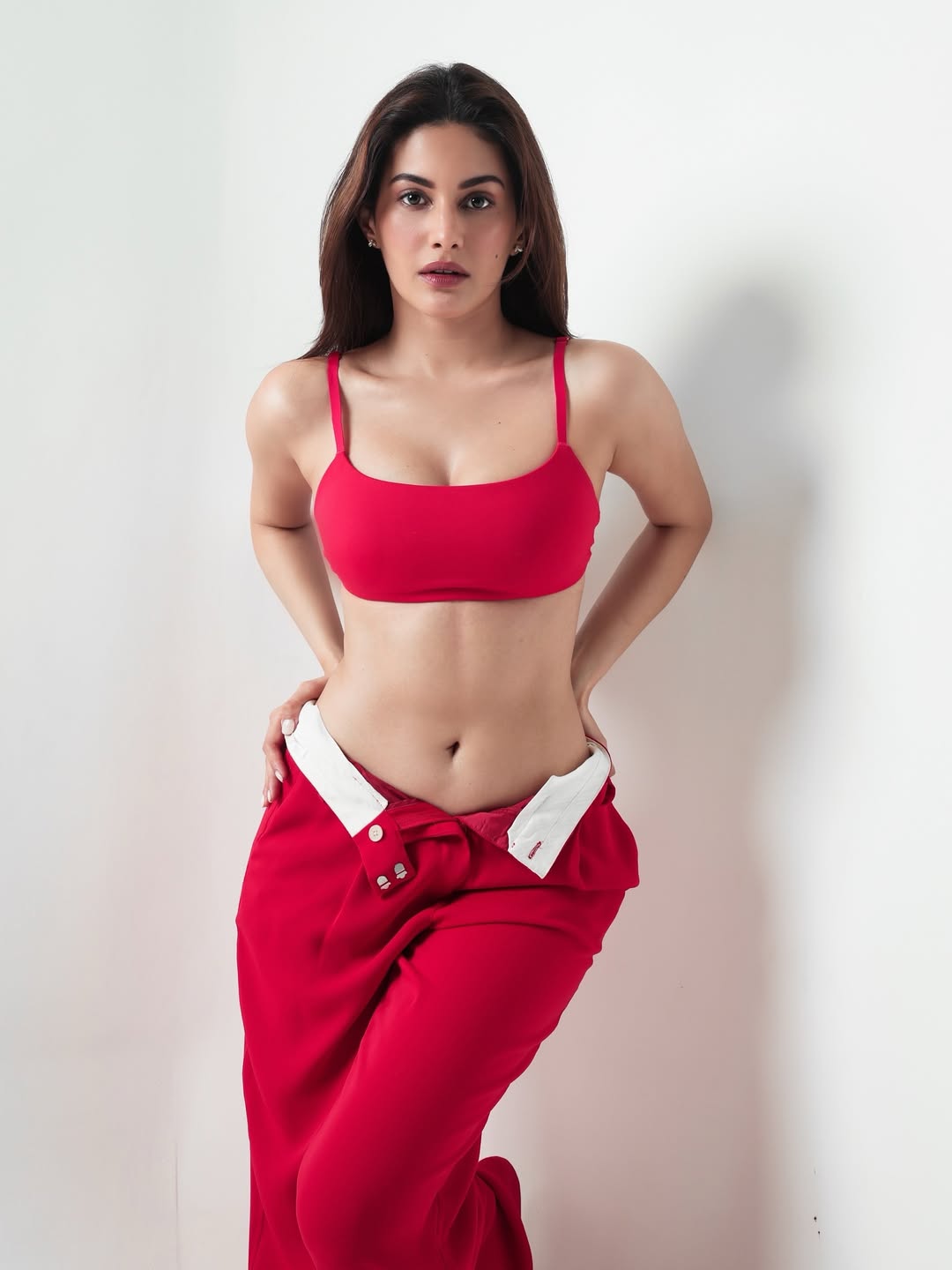 Amyra Dastur Sizzles In Bold Red Studio Look With Dynamic Glam Pose