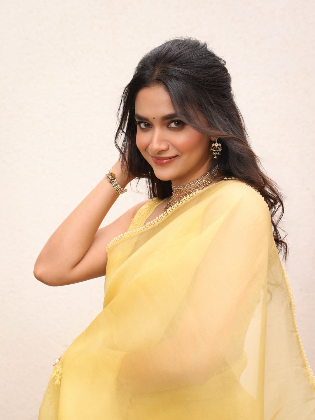 Keerthy Suresh Radiates Elegance in Yellow Saree, Begins New Film Journey