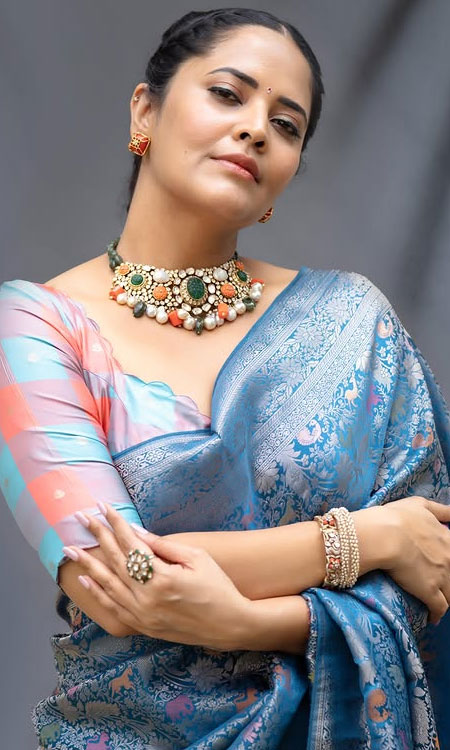 Anasuya Bharadwaj Dazzles In Elegant Blue Saree Photoshoot
