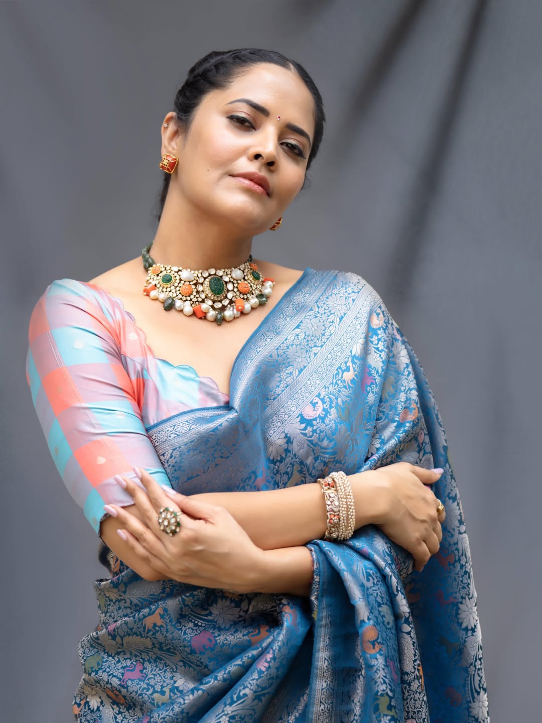 Anasuya Bharadwaj Dazzles In Elegant Blue Saree Photoshoot