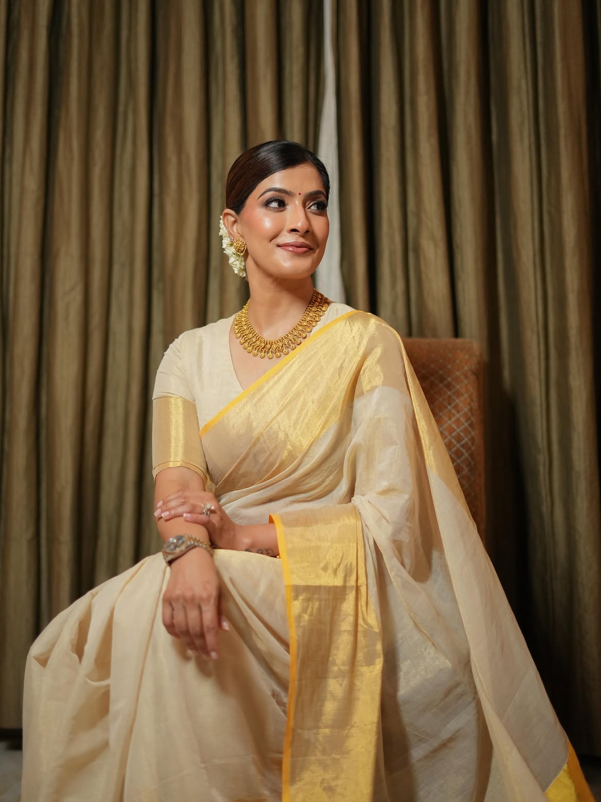 Varalaxmi Sarathkumar Radiates Grace in Classic Cream-Gold Saree Look