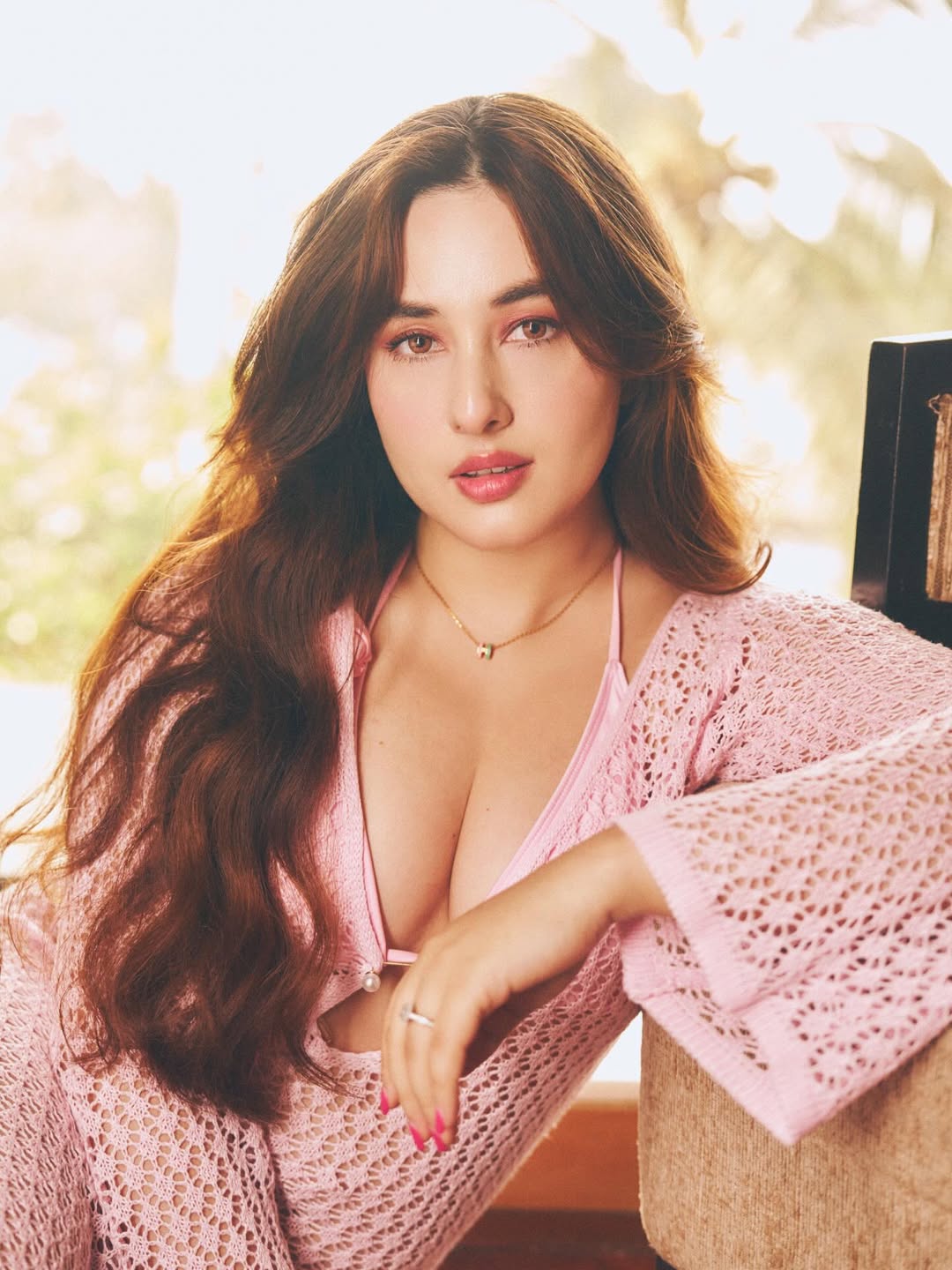 Aditi Budhathoki Stuns in Soft Pink Crochet Look Under Natural Light