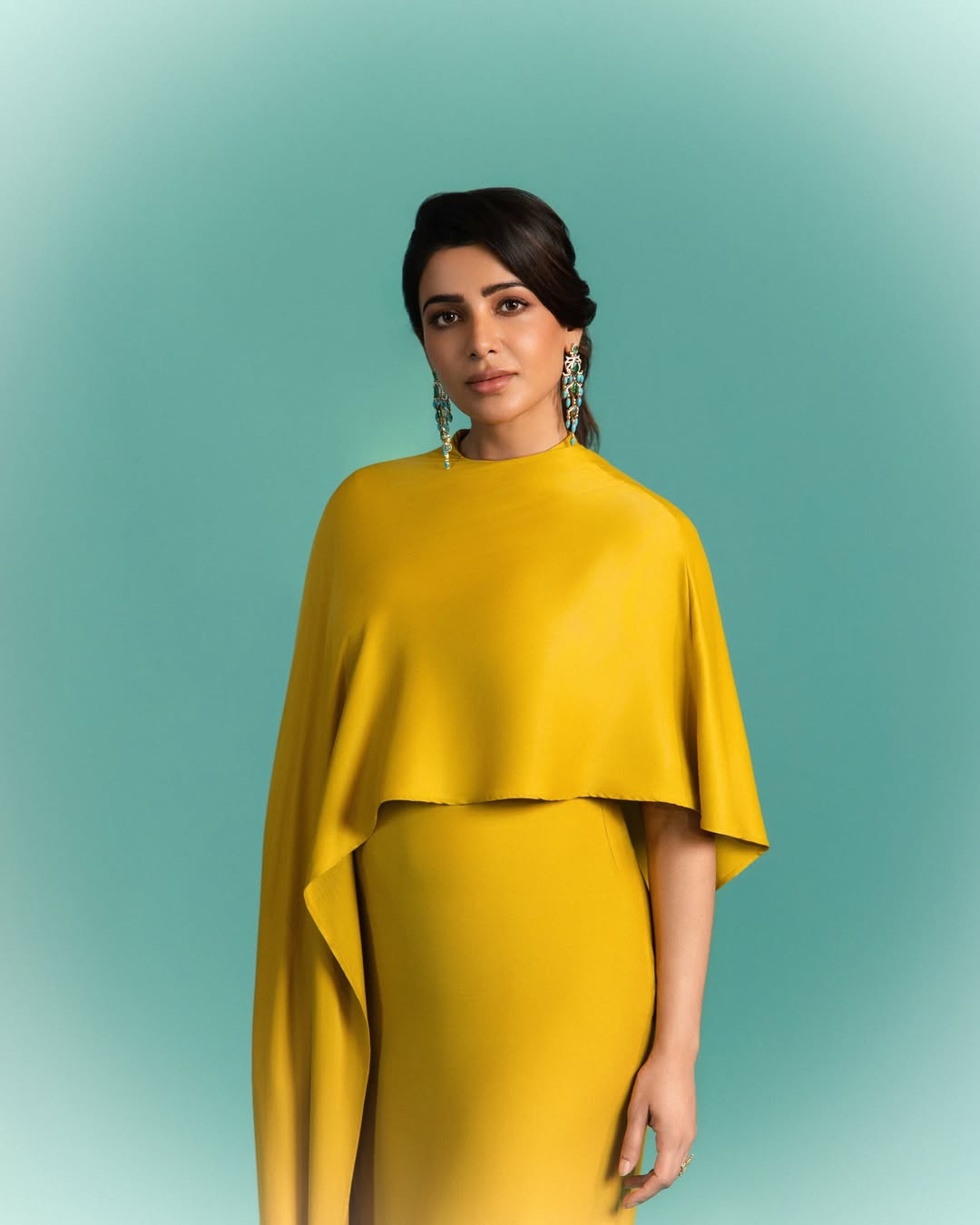 Samantha Shines in Chic Mustard Cape Elegance