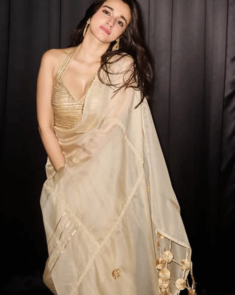 Nuveksha Shines in Golden Saree Look