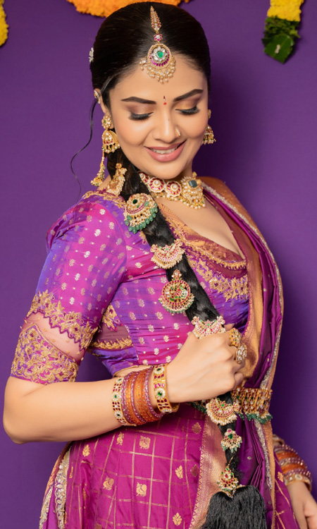 Sreemukhi Stuns in a Regal Purple and Gold Traditional Look