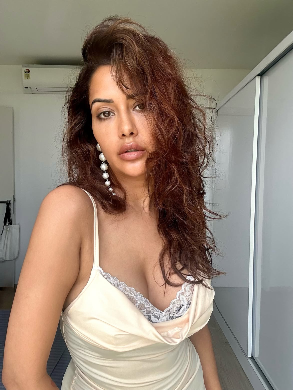 Raiza Wilson Stuns in a Glamorous Cream Satin Slip Dress