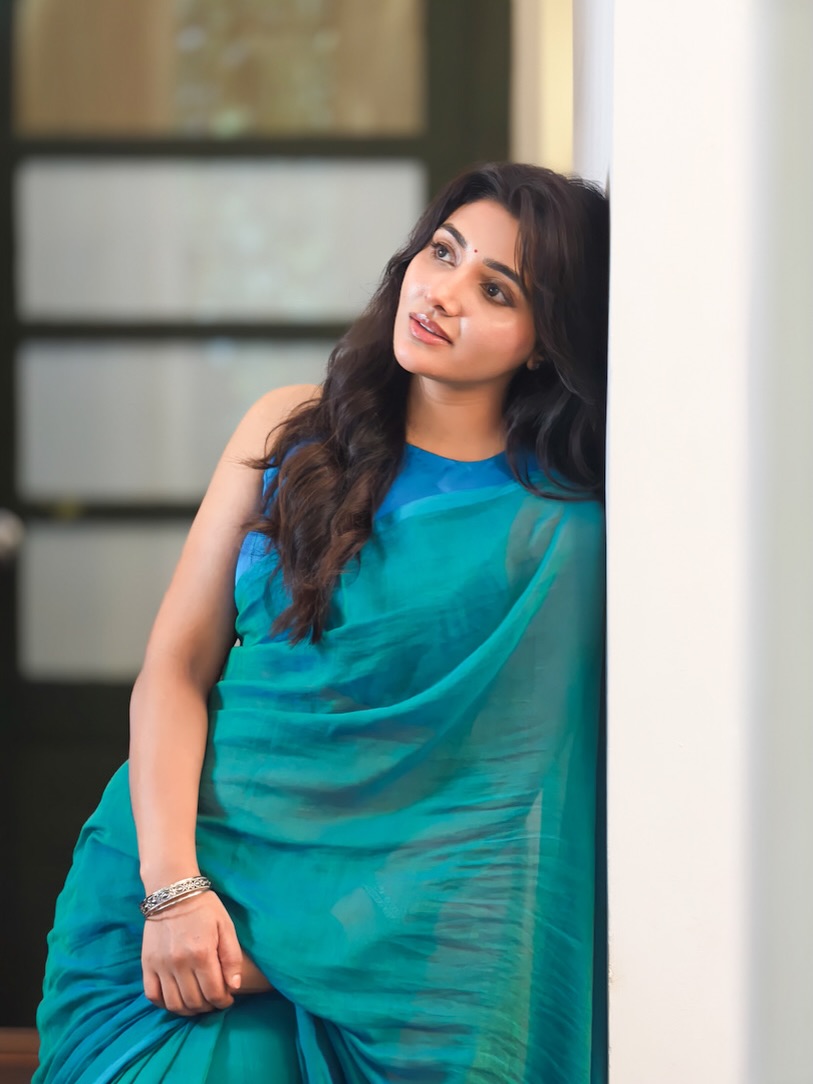 Mirnaa Looks Ethereal in a Teal Saree as She Reconnects with Her Idukki Roots