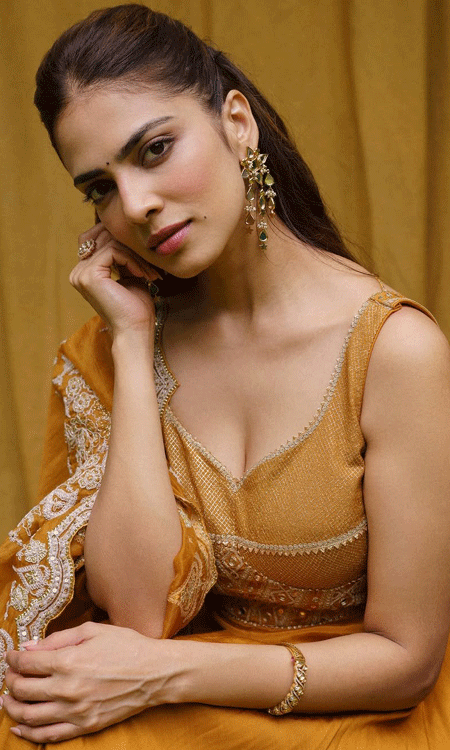 Malavika Mohanan Stuns in Elegant Mustard-Gold Traditional Look