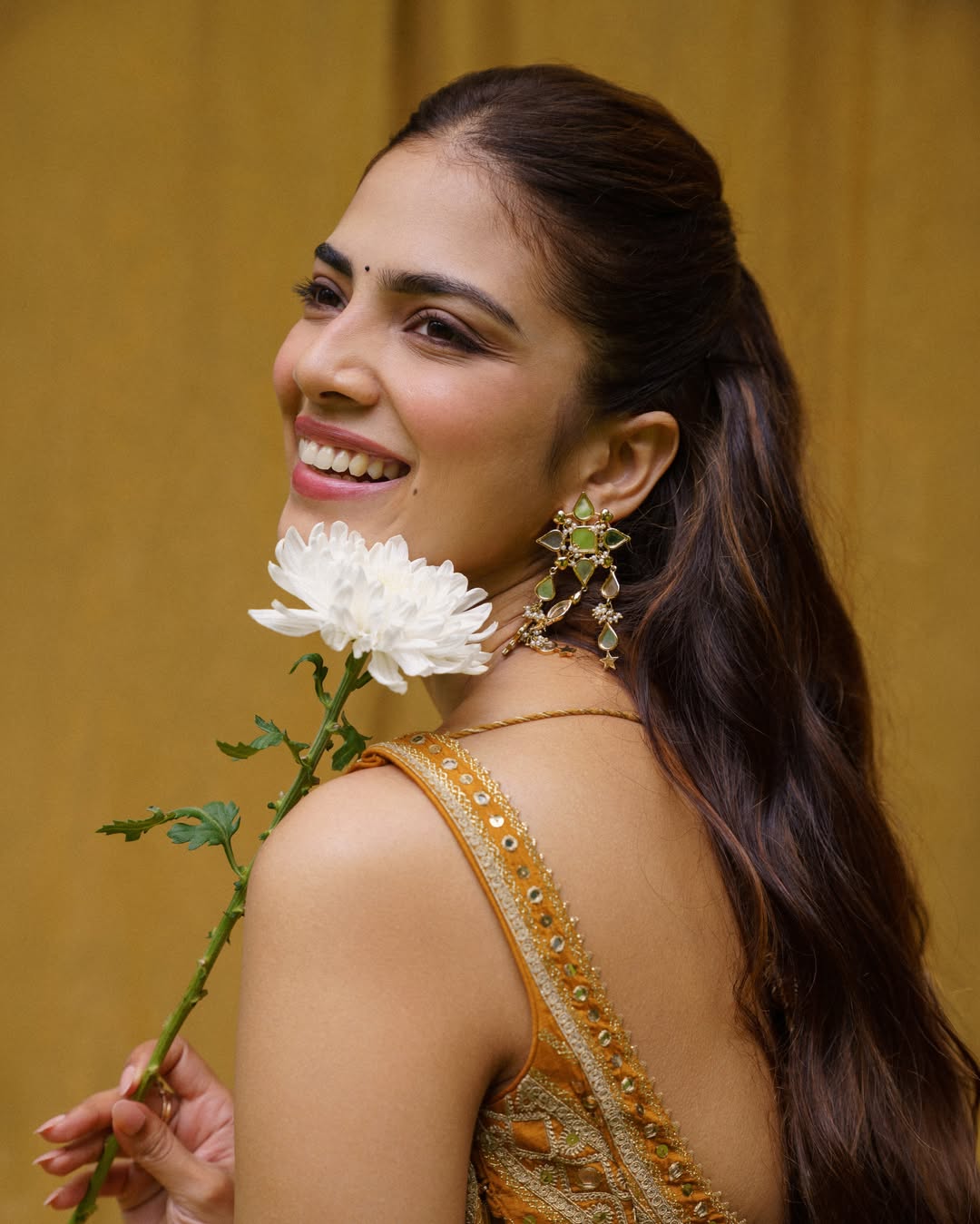 Malavika Mohanan Stuns in Elegant Mustard-Gold Traditional Look