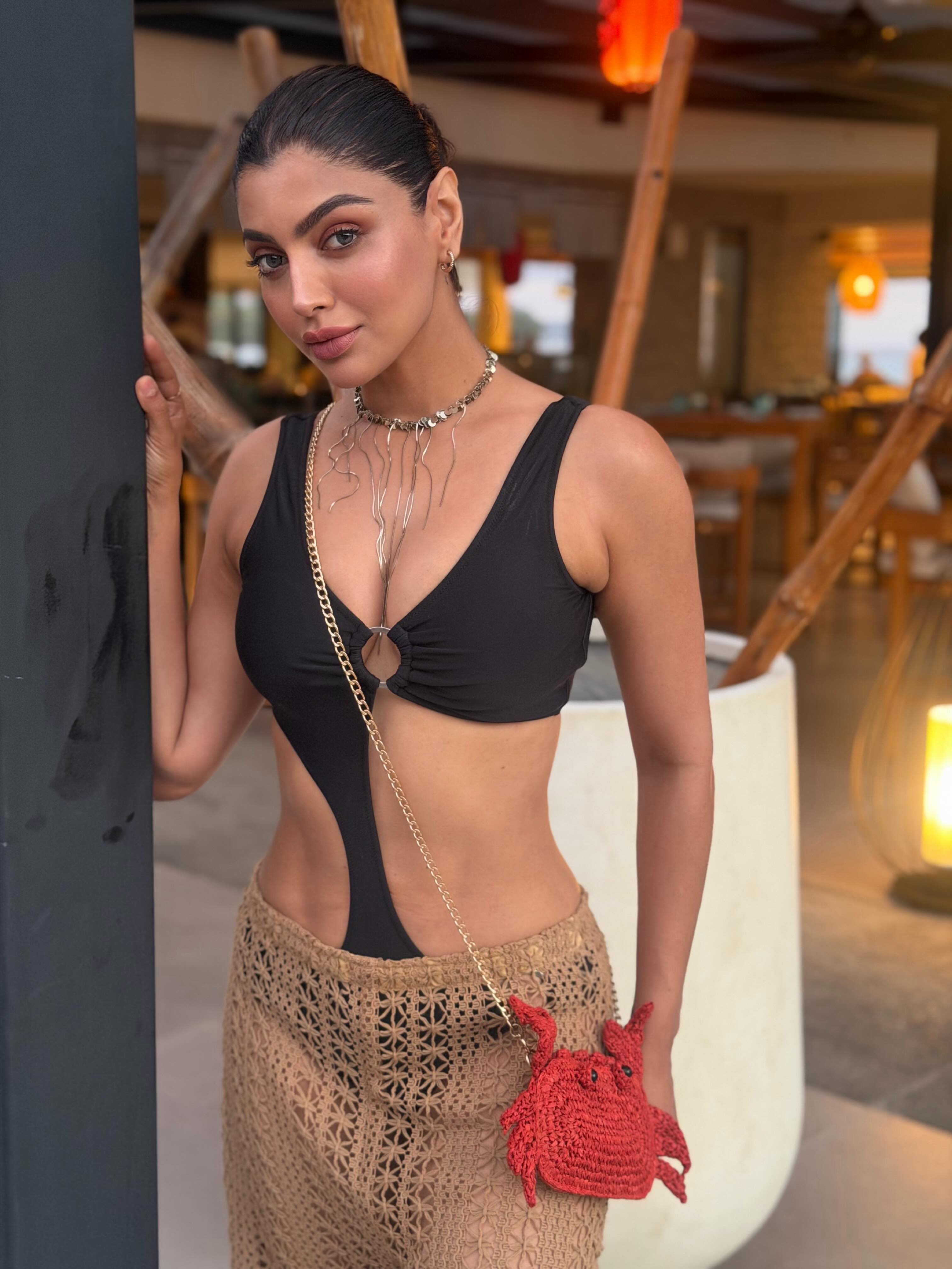 Akanksha Puri Turns Up the Heat in a Black Swimsuit