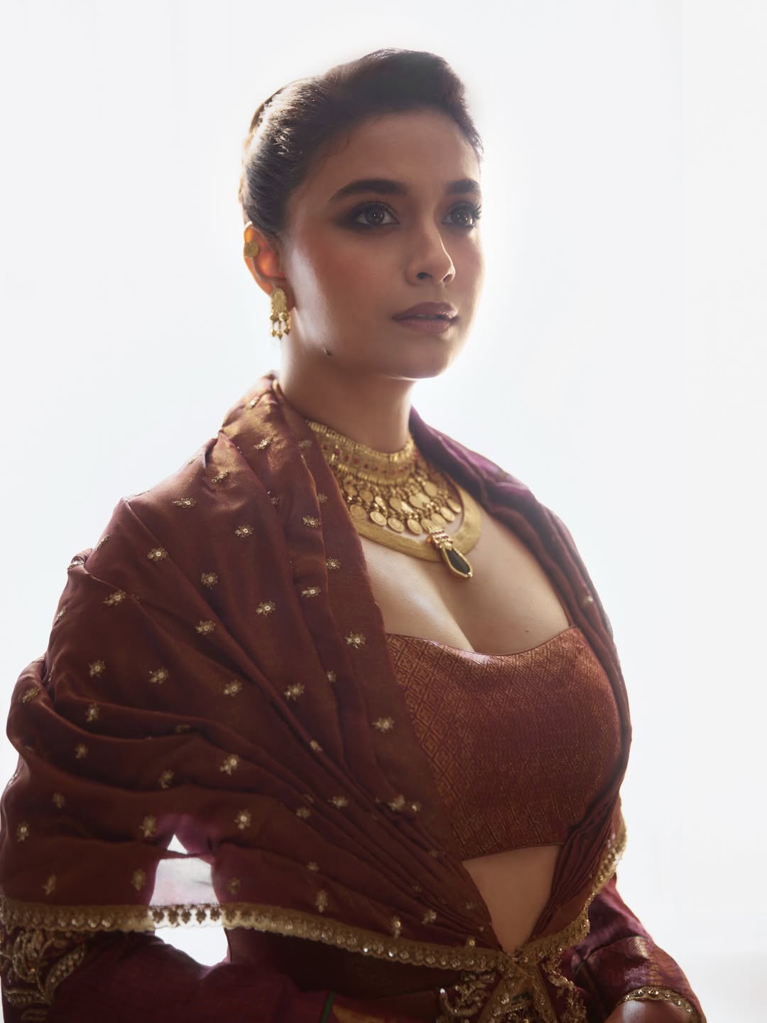 Keerthy Suresh Captivates in Deep Rust Tones